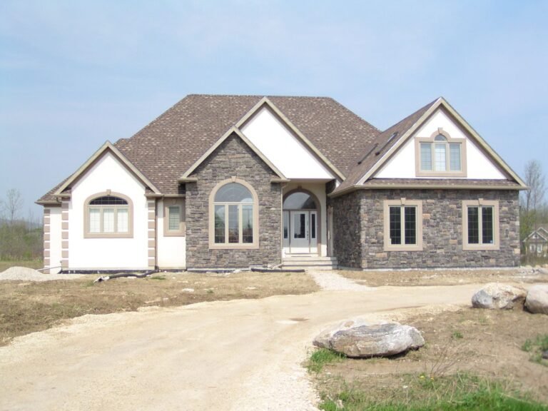 Front of a stone and stucco bungalow near Blue Mountain