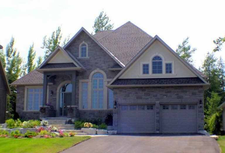 Finished cut stone bungalow with double garage