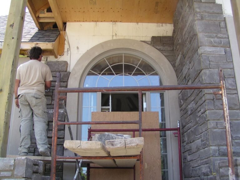 Stone veneer going on at the front entry