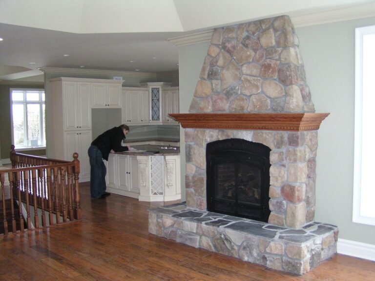 Fieldstone fireplace in a home with radiant floors