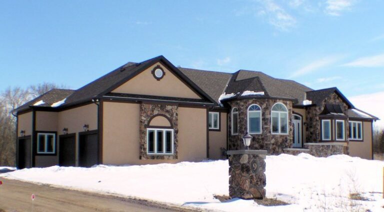Dining room with arched windows in a finished ICF bungalow