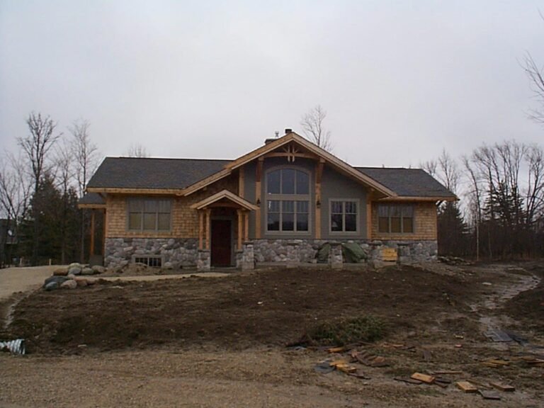 Cottage with stone base and cedar gable