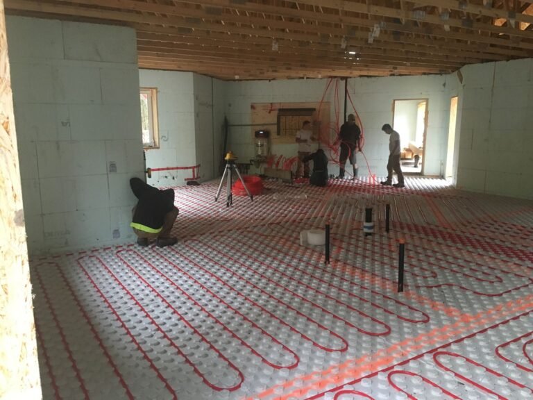 Crew laying in-floor heat in a large ICF bungalow