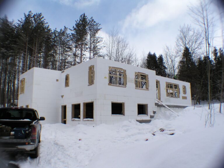 Two-storey ICF walls standing in the snow before the pour